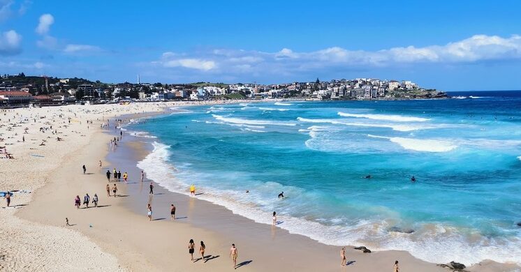 Bondi-Beach-with-surfers-and-golden-sand